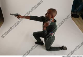 11 2018 01 ERIC KNEELING POSE WITH GUNS